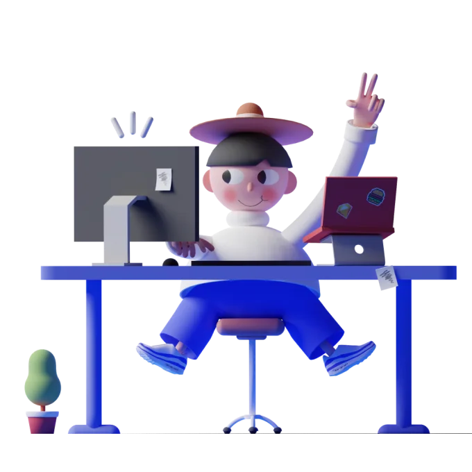 Learner working across a computer and laptop